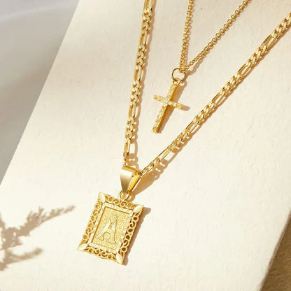 halsbandset med kors och initial | Guld