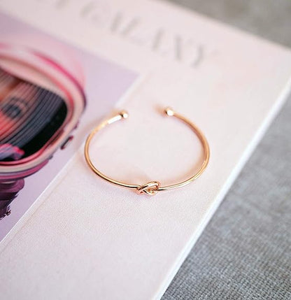 Infinity-armband med kärleksknut | Guld